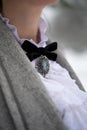 Vintage white collar with black bow and cameo brooch Royalty Free Stock Photo