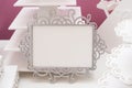 Vintage white frame on a table and place for text Royalty Free Stock Photo