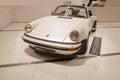 vintage white Porsche 911 Turbo 3.3, classic car on display Porsche museum, Oldtimer car retro-style, automotive passion, history