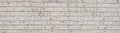 Vintage white wash brick wall texture for design. Panoramic background for your text or image