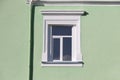 Vintage white window on mint green wall in sunlight Royalty Free Stock Photo