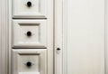 Vintage white wooden cupboard doors with metal handles Royalty Free Stock Photo