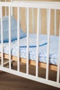 Vintage white wooden decorated empty baby cot Royalty Free Stock Photo