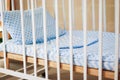 Vintage white wooden decorated empty baby cot Royalty Free Stock Photo