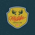 Vintage wilderness logo. hand drawn retro styled outdoor adventure emblem. vector illustration Royalty Free Stock Photo