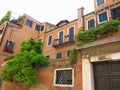 Vintage window and detail of a classical building in the historical center of Venezia. Royalty Free Stock Photo