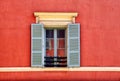 Vintage window with grey shutters in old red stucco house, Nice, France Royalty Free Stock Photo