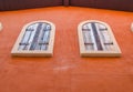 Vintage window on orange cement wall Royalty Free Stock Photo