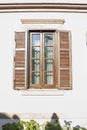 Vintage window with shutters on the wall of an old house..window in Cunda Turkey old construction and wood the historical Royalty Free Stock Photo