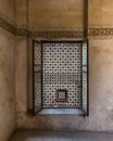 Vintage window with wooden arabesque ornaments - Mashrabiya - and grunge stone wall Royalty Free Stock Photo