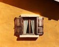 Vintage window on yellow cement wall Royalty Free Stock Photo