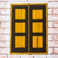 Vintage window on yellow cement wall Royalty Free Stock Photo