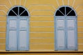 Vintage window on yellow cement wall Royalty Free Stock Photo