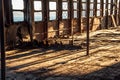 Vintage windows without a shipwreck with sea view. Rusty hull of a burned ship