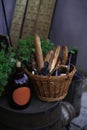 Vintage wine bottle and basket with bread still life of restaurant patio outdoor space marketing object, vertical photo Royalty Free Stock Photo