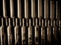 Vintage wine bottles in wine cellar with dust on them Royalty Free Stock Photo
