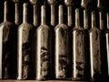 Vintage wine bottles in wine cellar with dust on them Royalty Free Stock Photo