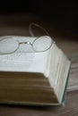 Vintage glasses resting on an old book