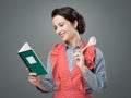 Vintage woman with cookbook Royalty Free Stock Photo