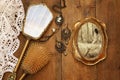 Vintage woman toilet objects next to old photography