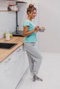 Vintage woman in white breakfast cooking with flakes and milk. Diet, mousse, cornflakes - the concept of healthy eating.