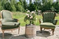 Vintage wood chairs and table with flower decoration in garden. outdoor Royalty Free Stock Photo