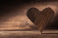 Vintage wood heart on woode background close up