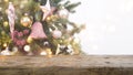 Vintage wood table top in front of blurred Christmas tree