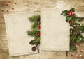 Vintage wood texture with old cards, holly and firtree. Christmas postcard Royalty Free Stock Photo