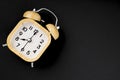 A Vintage wooden alarm clock on black background with copy space Royalty Free Stock Photo