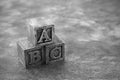 Vintage wooden alphabet blocks on dark background Royalty Free Stock Photo