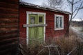 Vintage wooden barn with a vibrant green door and window near Toten and Lake Mjosa in Norway Royalty Free Stock Photo