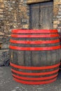 Vintage wooden barrel with bright red hoops. Royalty Free Stock Photo