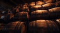 Vintage wooden barrels stored in old wine cellar. Many brown oak casks inside dark storage of winery. Concept of vineyard,