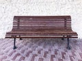 Vintage wooden bench on stone background Royalty Free Stock Photo