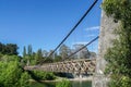 Vintage wooden bridge across the river in deep blue sky Royalty Free Stock Photo