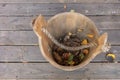 Vintage, wooden bucket with leaves, top view. Autumn background Royalty Free Stock Photo