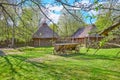 The vintage wooden cart in front of wicker barns, Mamajeva Sloboda Cossack Village, Kyiv, Ukraine Royalty Free Stock Photo