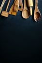 Vintage Wooden Cooking Utensils Framing Black Slate Background Royalty Free Stock Photo