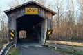 Vintage wooden covered bridge on rural road Royalty Free Stock Photo