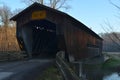 Vintage wooden covered bridge on rural road Royalty Free Stock Photo