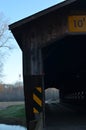 Vintage wooden covered bridge on rural road Royalty Free Stock Photo