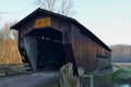 Vintage wooden covered bridge on rural road Royalty Free Stock Photo