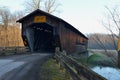 Vintage wooden covered bridge on rural road Royalty Free Stock Photo