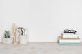 Vintage wooden desktop with books and office or school supplies