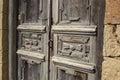 Vintage wooden door in abandoned clay arabian house, old building ruins in dagesnta city, russian Royalty Free Stock Photo