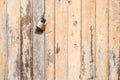 Vintage wooden door texture background with old steel lock. Royalty Free Stock Photo