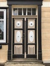 Vintage wooden entry door in aged stone house