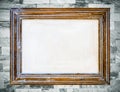 Vintage wooden frame on old marble wall background. Royalty Free Stock Photo