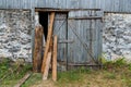 A vintage wooden gate of farmhouse or barn, old broken boards need to be repaired Royalty Free Stock Photo